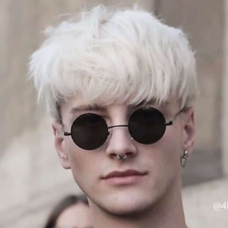 A Fresh Fringe Styled On Platinum Blond Hair. The Fringe Is Trimmed Perfectly To Cover The Entire Forehead