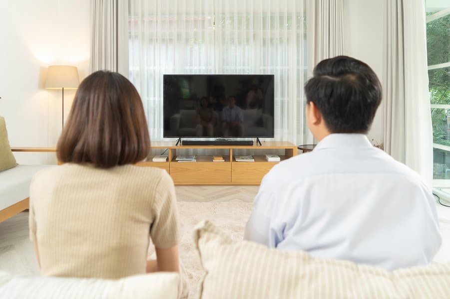 couple watching a movie on tv blank screen