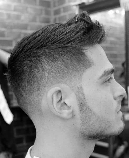 Faux Hawk Mens Short Hairstyle With Taper Fade On Sides