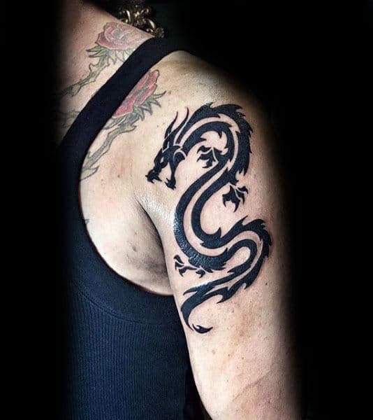 Gentleman With Tribal Dragon Arm Tattoo
