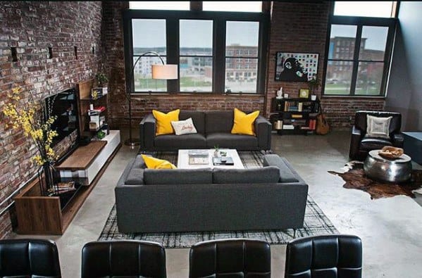 dark upholstery with yellow pillows 