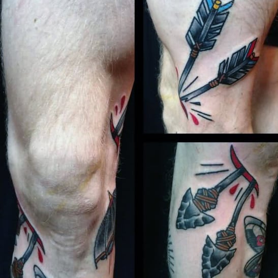Male With Knee Cap Traditional Arrow Through Skin Tattoo