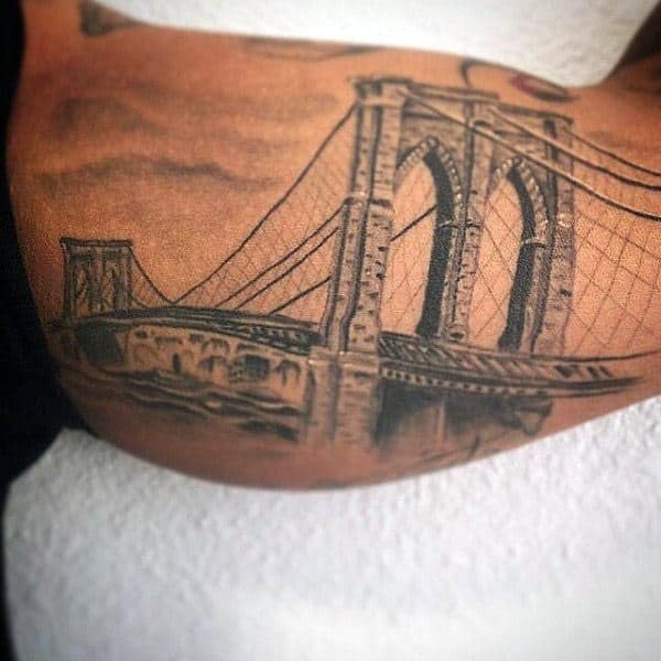 Man With Bicep Inner Arm Brooklyn Bridge Tattoo