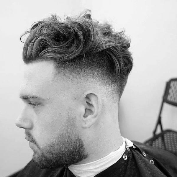 Manly Medium Wavy Hairstyles For Men With High Fade