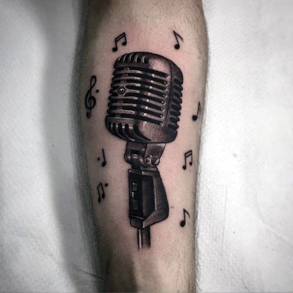 Microphone With Musical Notes Tattoo On Forearm
