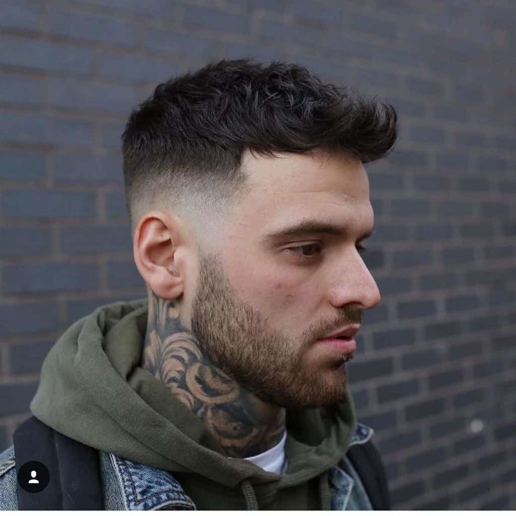 Wavy texture hair on top and mid faded sides and back