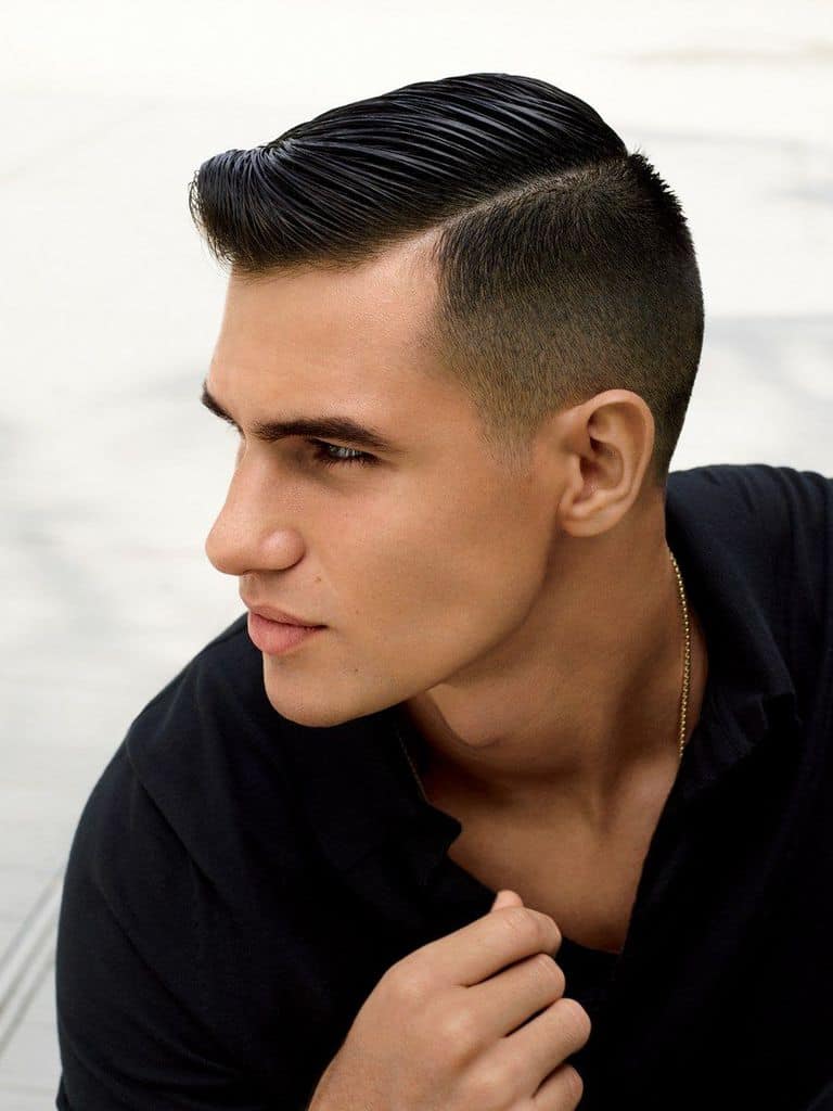 A mod fade haircut with lightly long hair on top and short sides and back