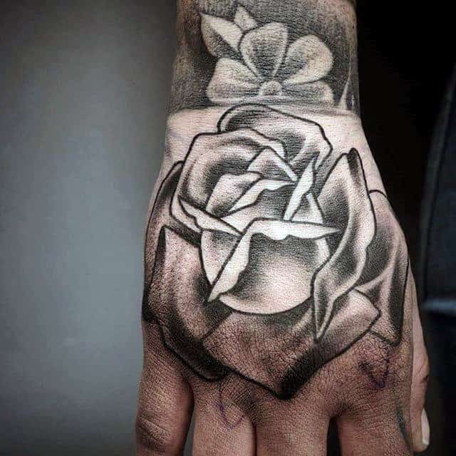 nextluxury hand 3 black and grey rose tattoos