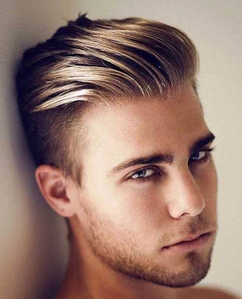 man with sharp slicked back fohawk hairstyle