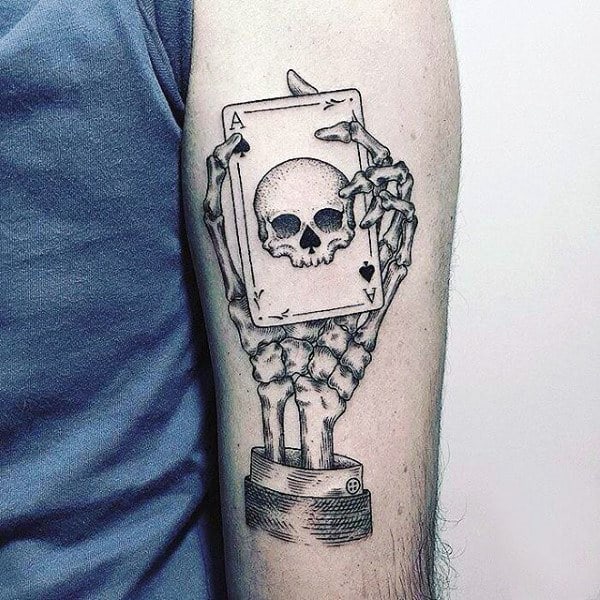 Skeleton Hand With Ace Of Spades Playing Card Tattoo On Male