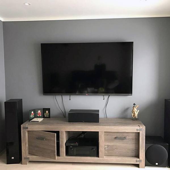 wall mounted tv and wooden cabinet